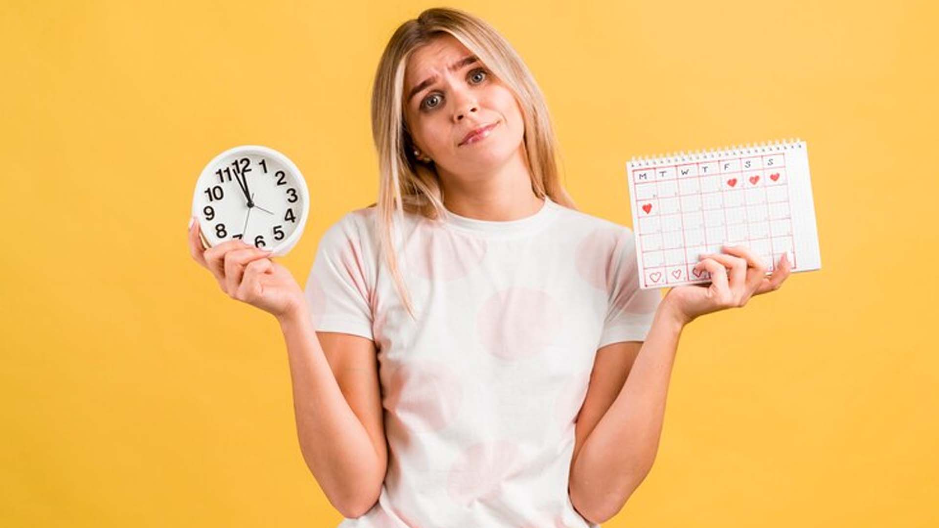 Women holding Clock and period calendar